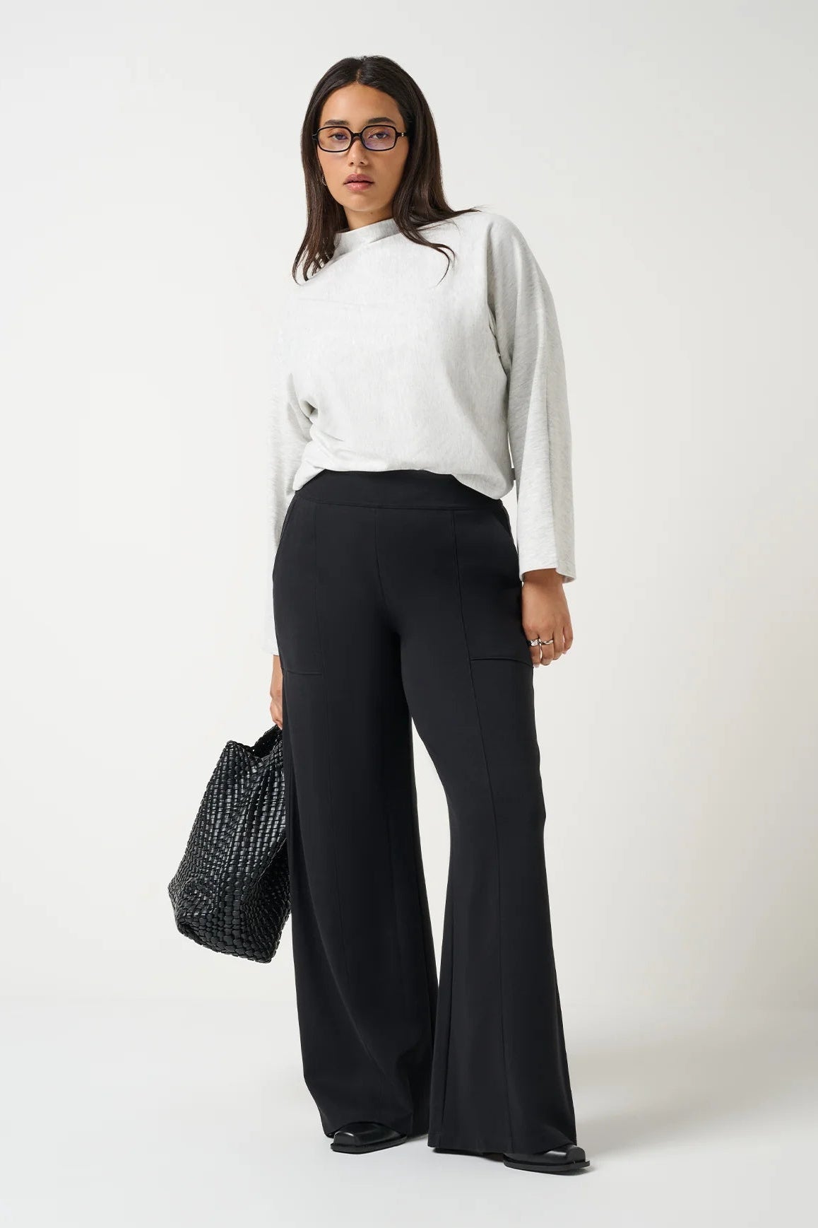 woman in gray top and black pants