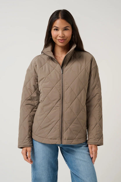 woman in quilted puffer jacket