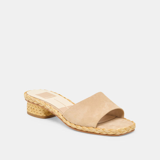 Beige sandal with woven sole on a white background