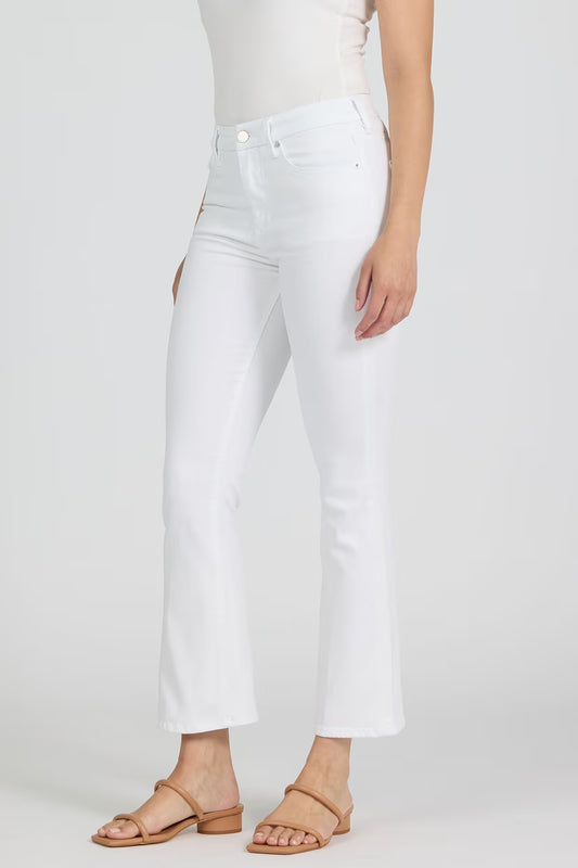 Person wearing white jeans on a plain background