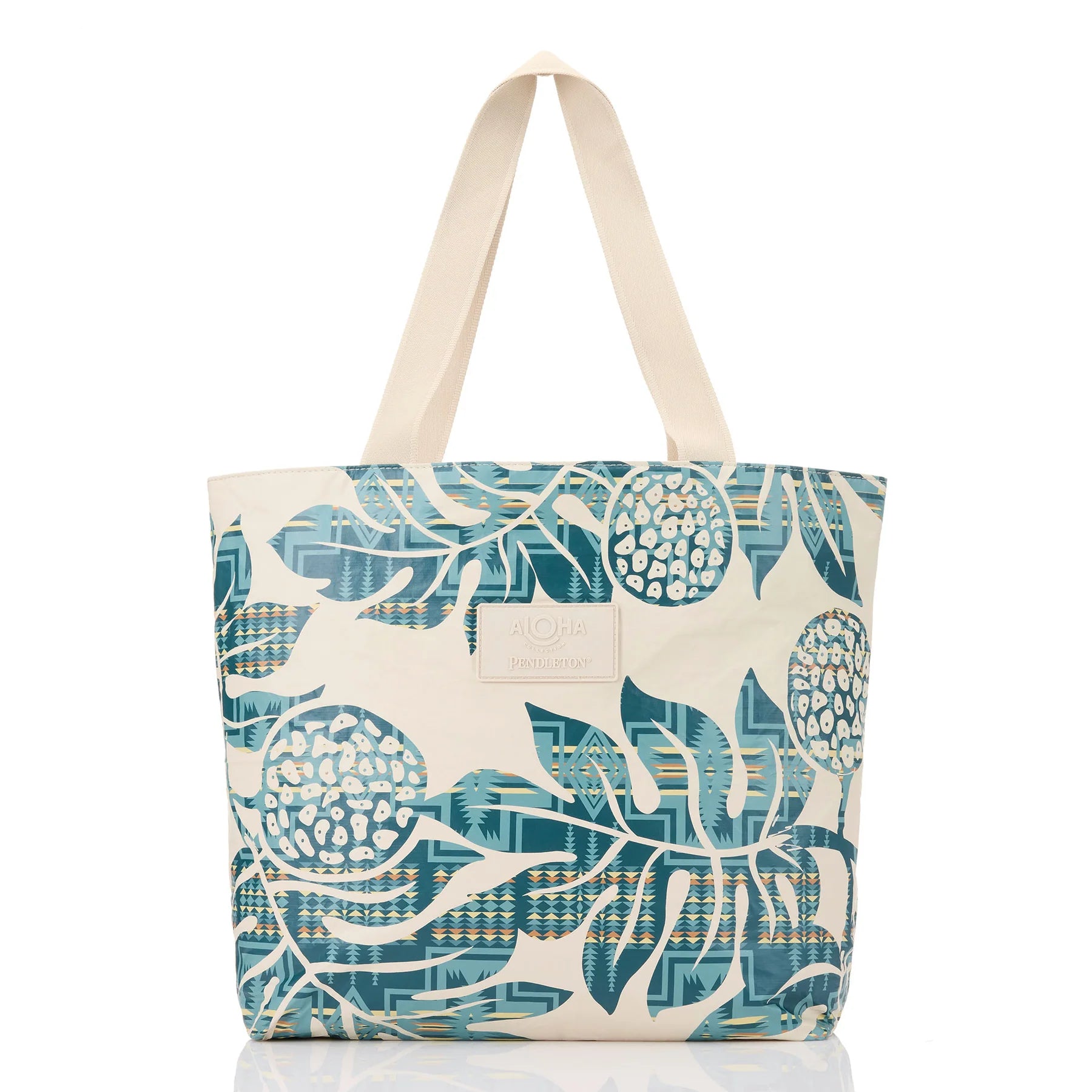 Tote bag with blue and beige leaf pattern on a white background