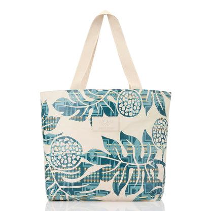 Tote bag with blue and beige leaf pattern on a white background