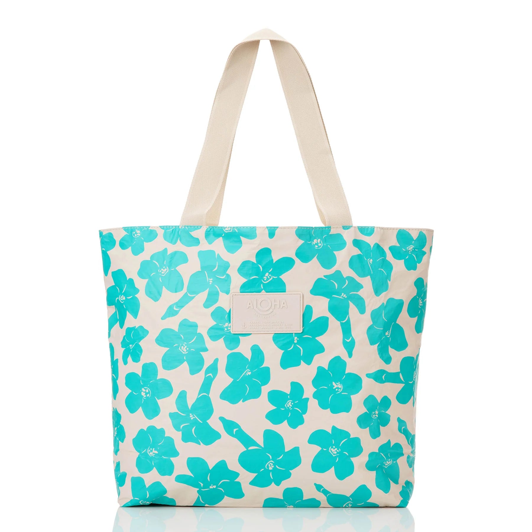 Tote bag with turquoise floral pattern on a white background