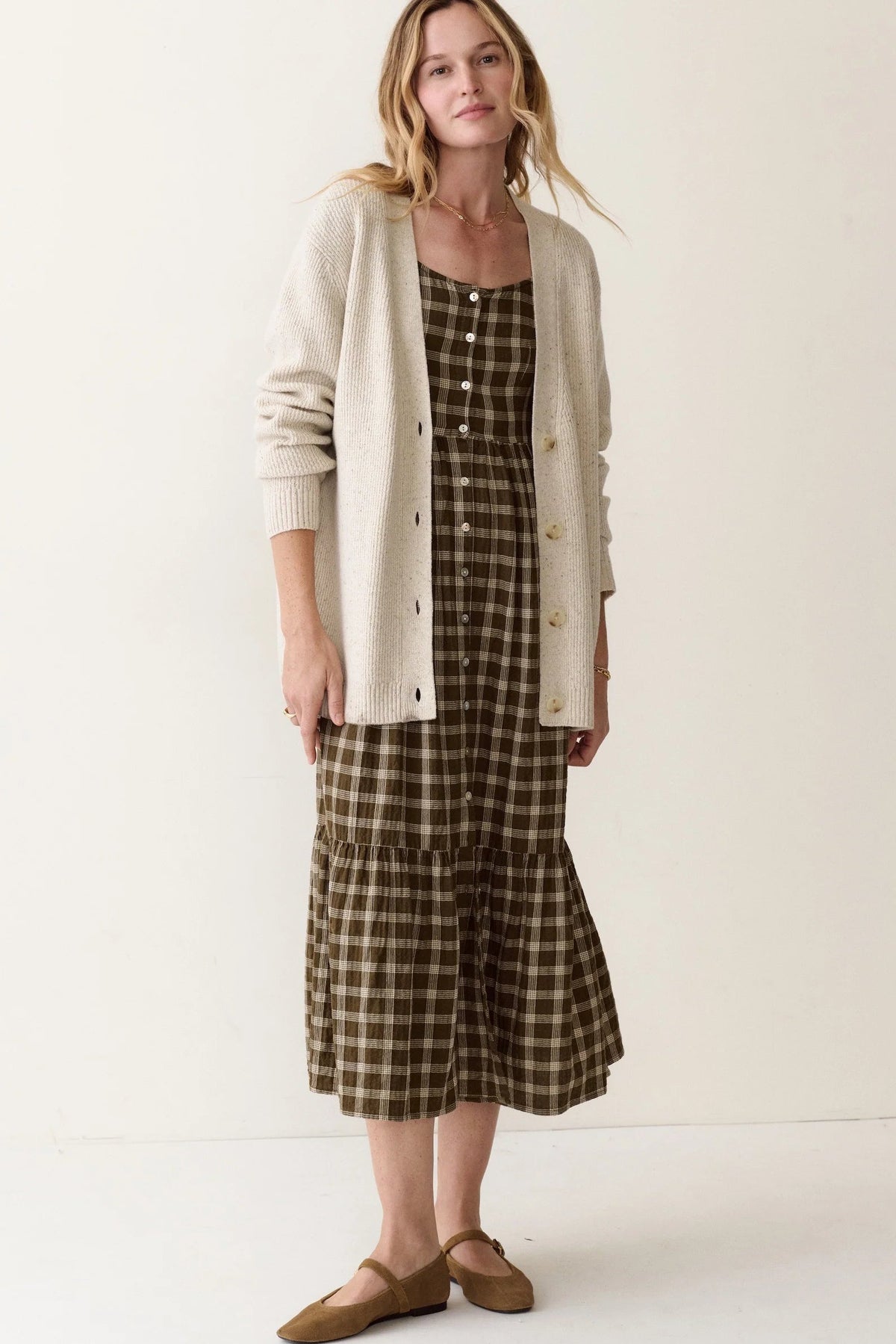 woman wearing dress with cardi