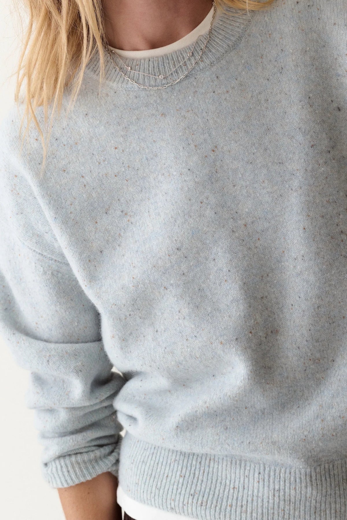 close up of light blue sweater