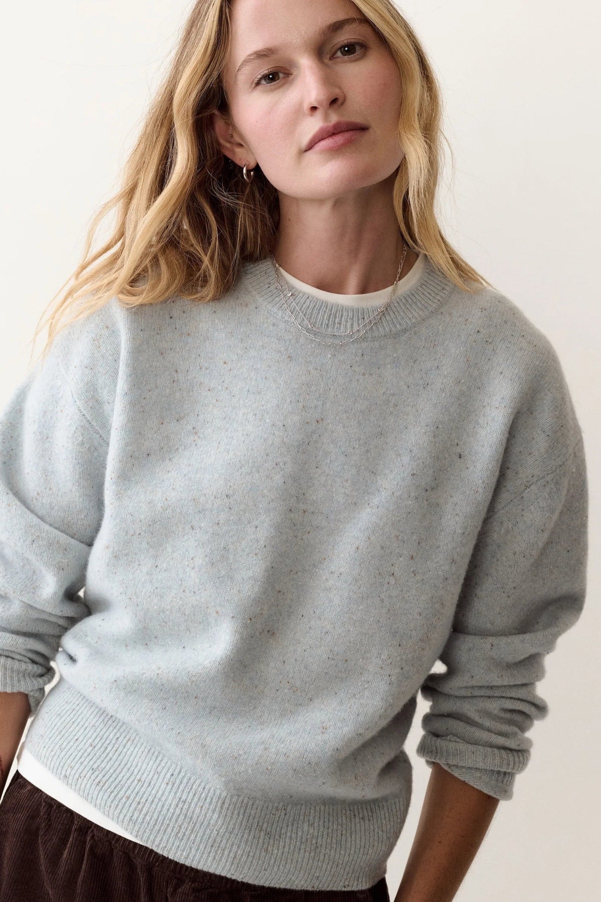 woman in light blue sweater