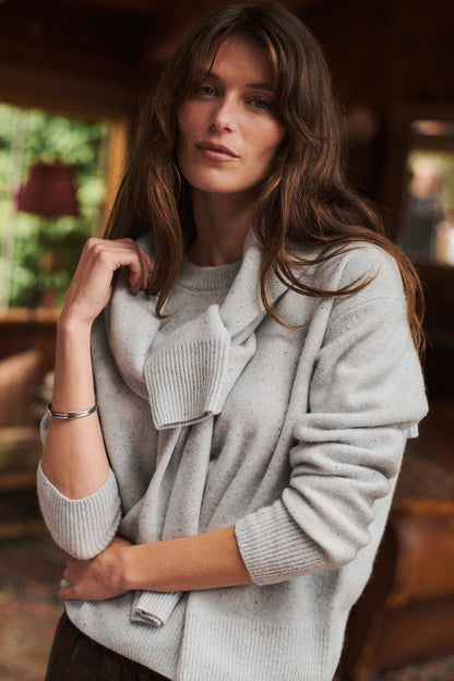 woman in light blue sweater