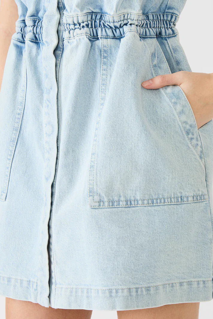 Light blue denim dress with a white background