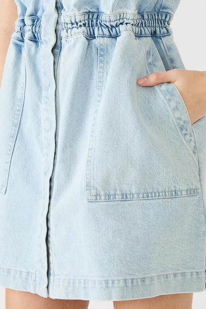 Light blue denim dress with a white background