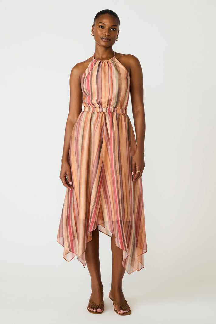 Woman wearing a striped dress on a white background