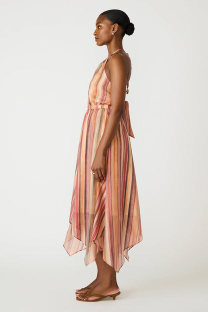 Woman wearing a striped dress on a white background