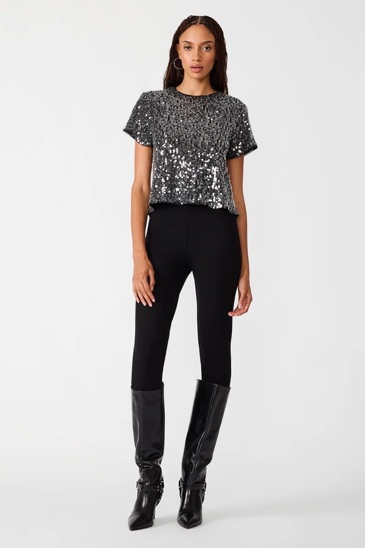 woman wearing sequin top with black pants