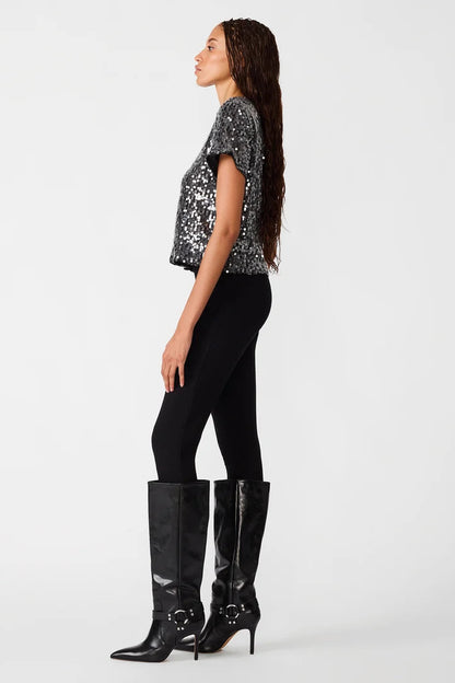 woman wearing sequin top with black pants