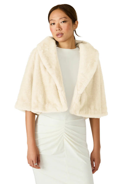 woman wearing fur coat with dress