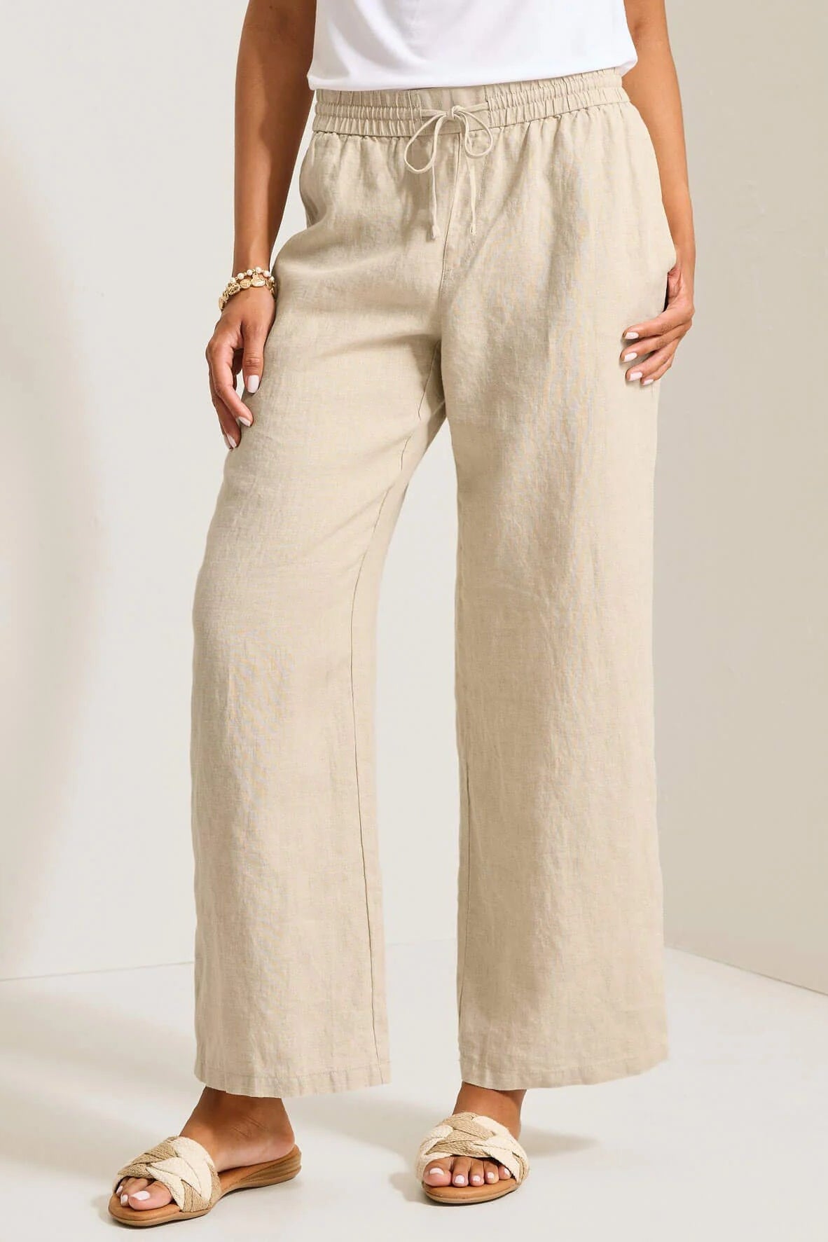 woman wearing linen pants with drawstring in natural color