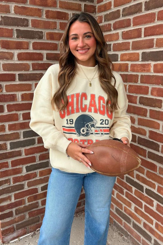 girl wearing football sweatshirt 