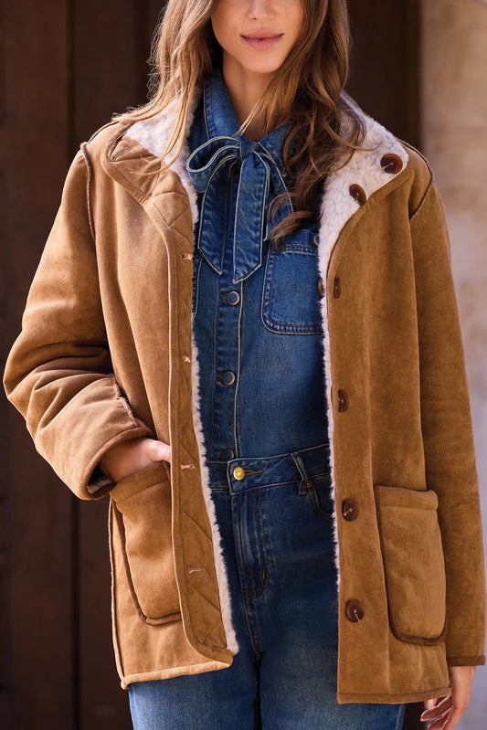 woman wearing suede coat with jeans