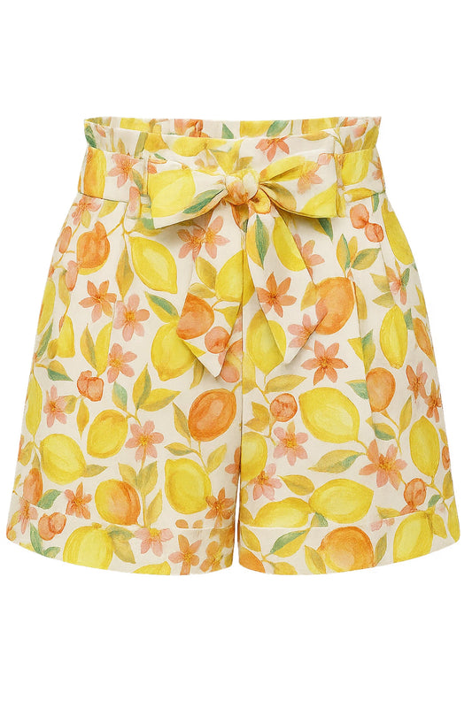 high rise cream shorts with yellow and orange fruit print