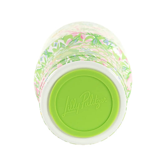Jelly bean jar with colorful jelly beans and green lid on a white background