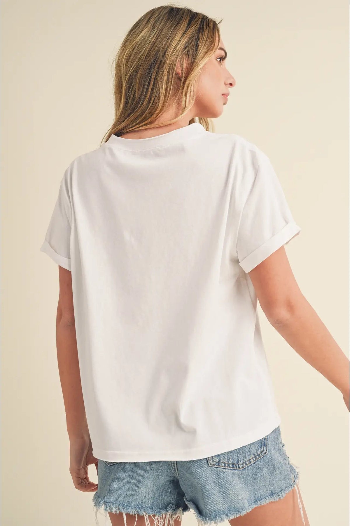 back view of woman in tee and shorts