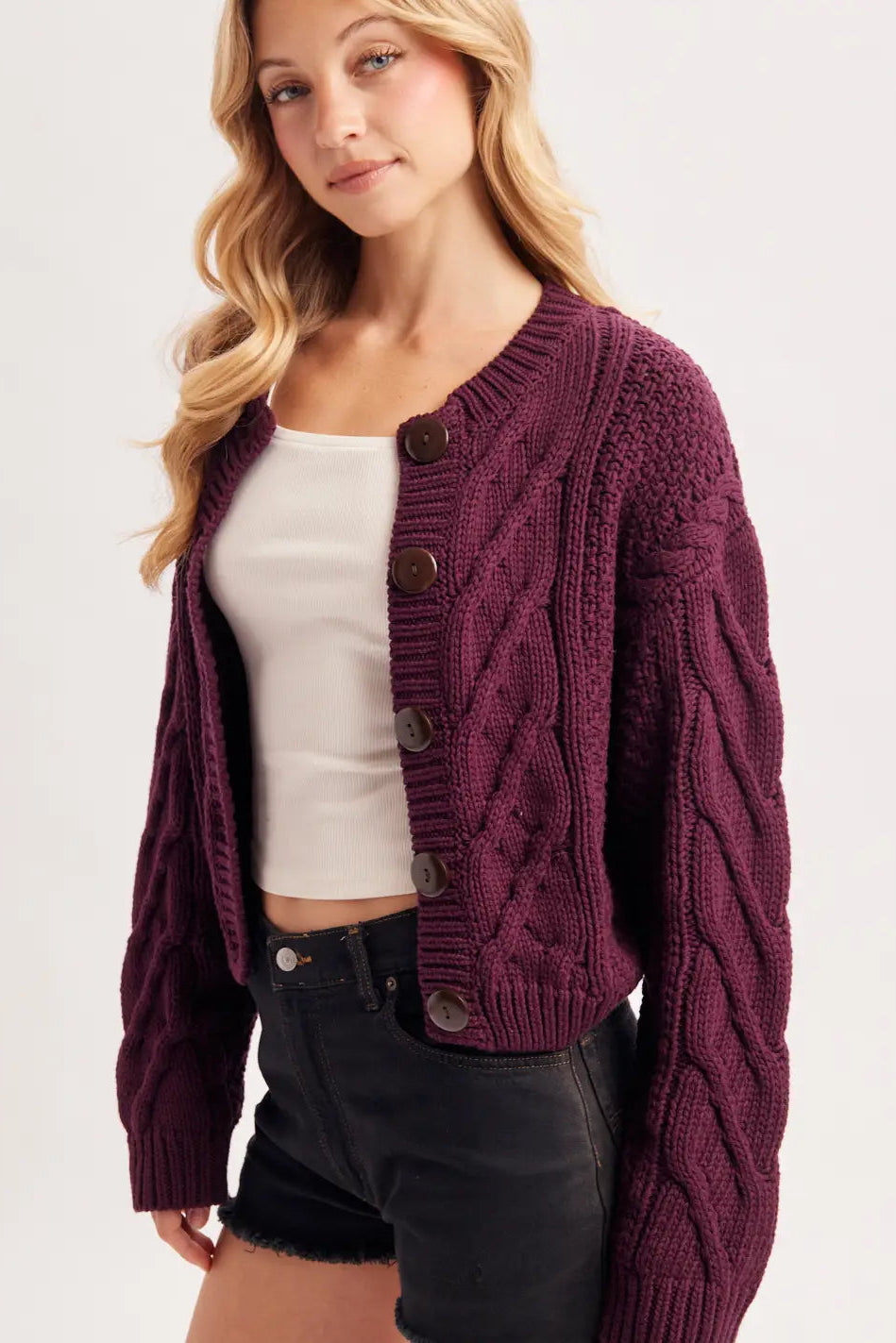 woman wearing plum cardigan
