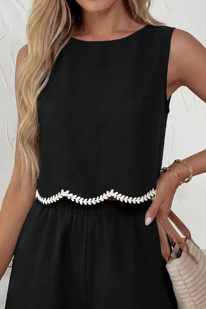 woman wearing black tank with white trim 