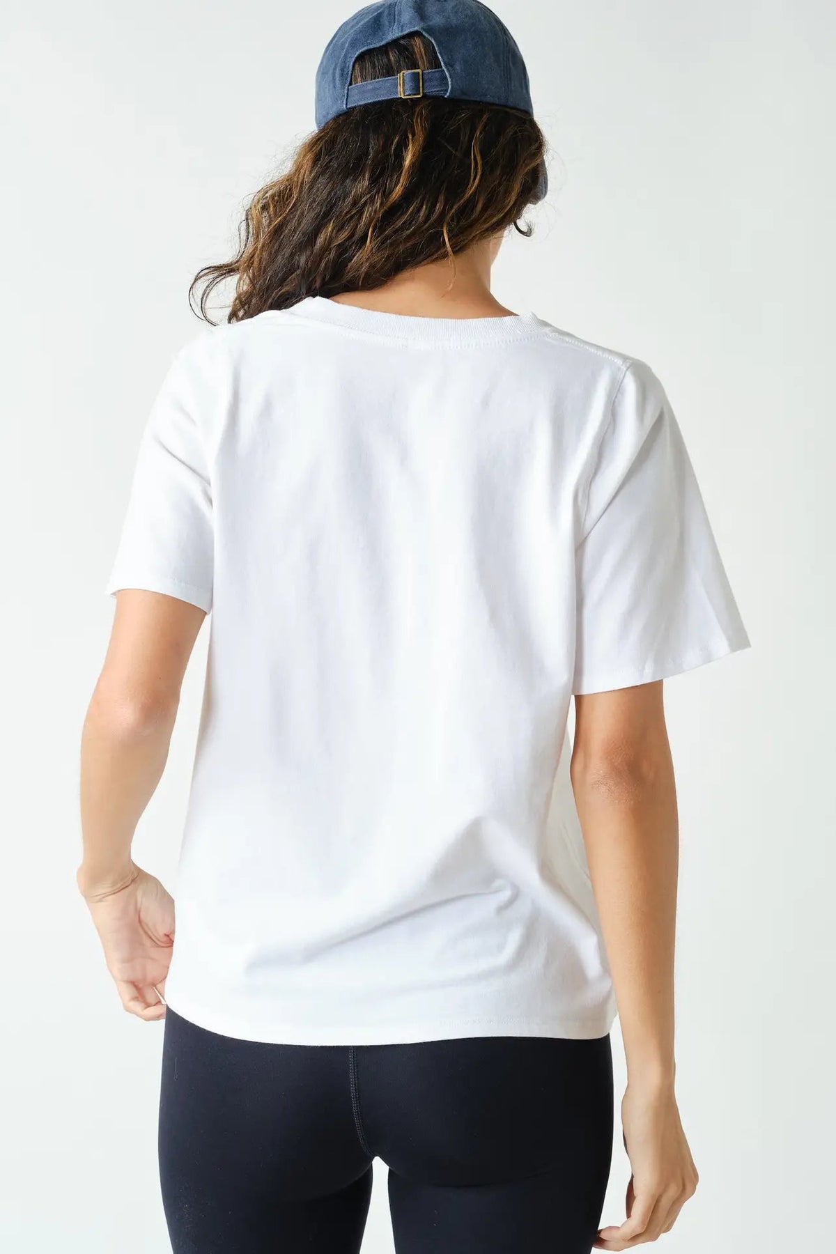 back view of woman in white tee