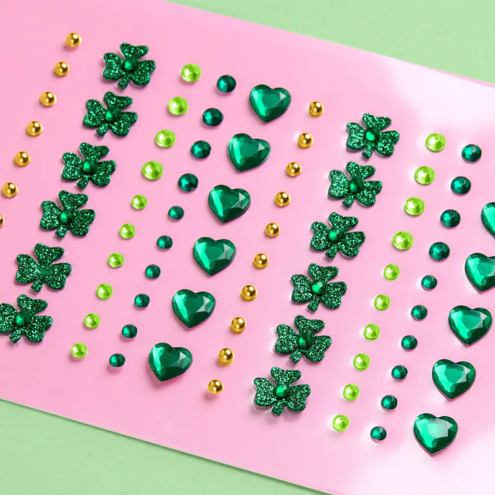 Green heart and clover-shaped decorations on a pink and green background