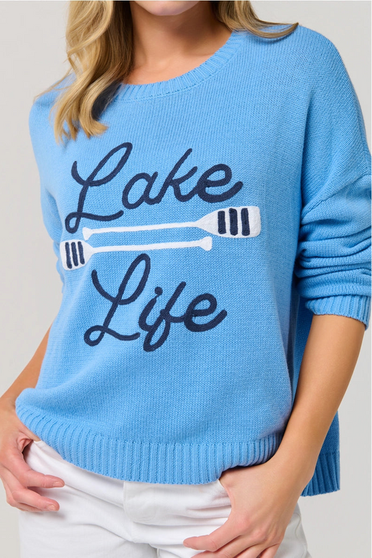 Blue sweater with 'Lake Life' and an oar design on a plain background