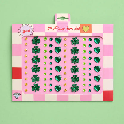 84-piece gem set packaging with green gems on a pink and white checkered background