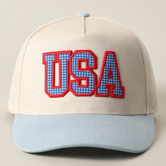 Cap with 'USA' text in red and blue on a beige and light blue background