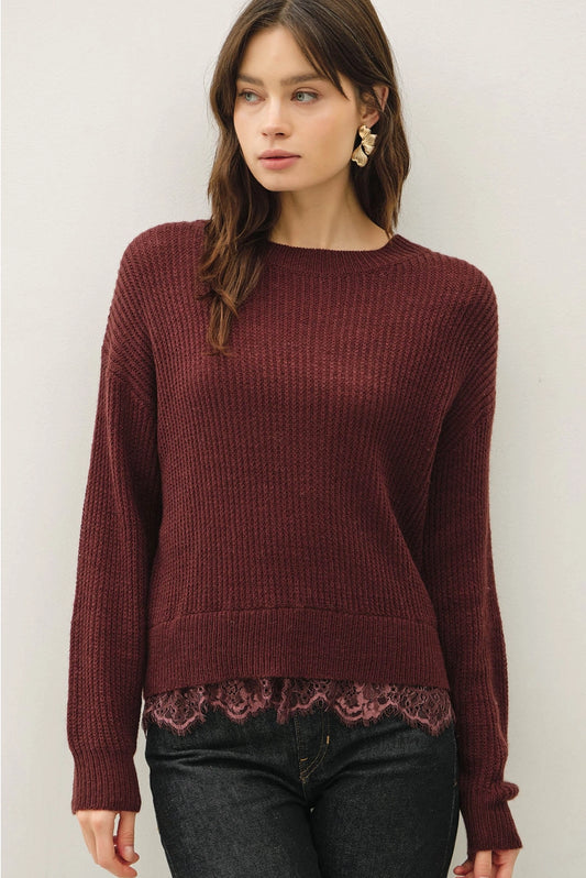woman in lace trimmed sweater and jeans