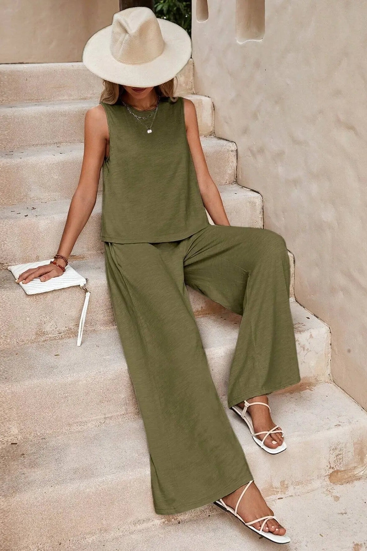 woman wearing matching green tank and pants