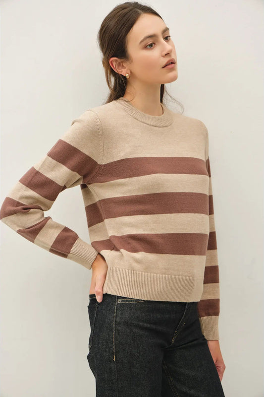 woman in striped sweater and jeans