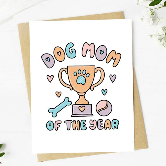 Greeting card with 'Dog Mom of the Year' design featuring a trophy and paw prints on a white background.