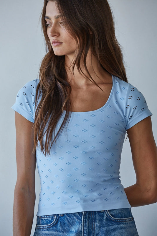 woman wearing blue top and jeans