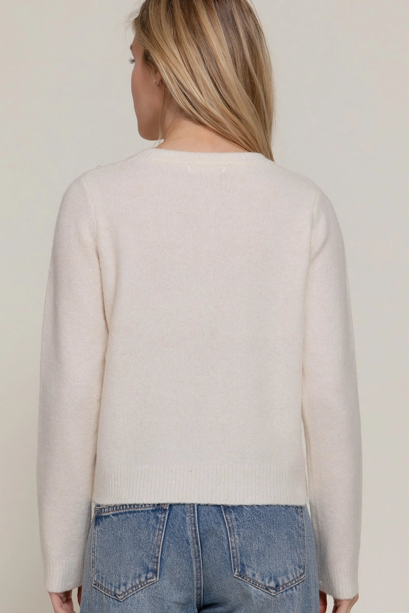 back view of woman in sweater and jeans