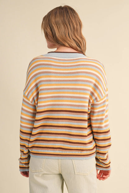 back view of woman in striped cardigan 