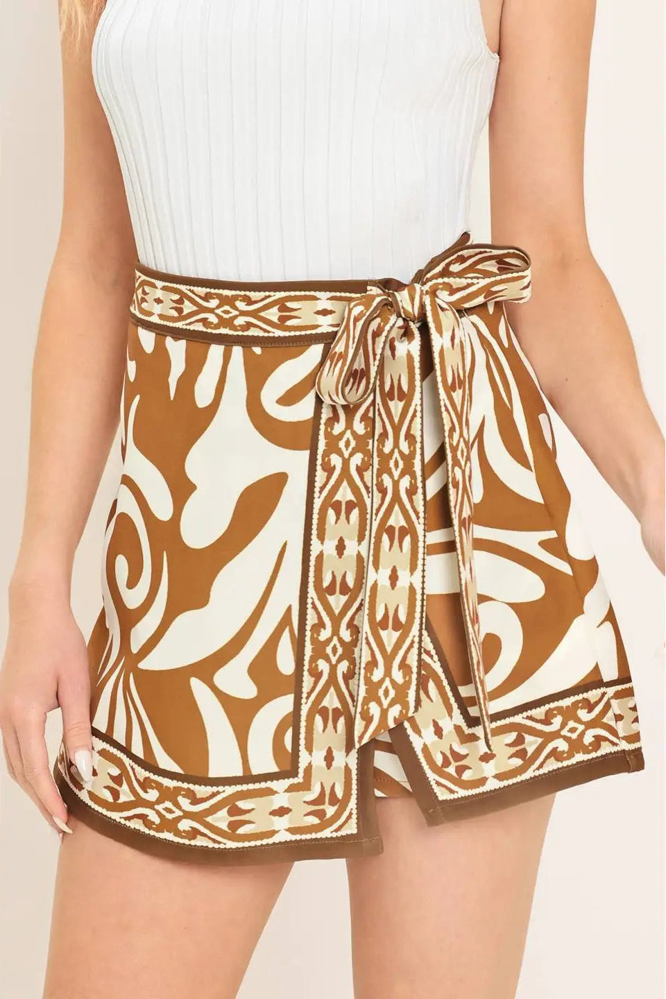 person wearing tan print skort 