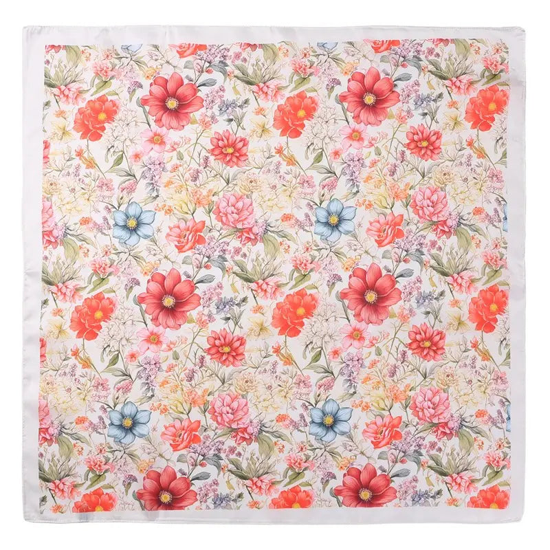 Floral patterned fabric with red, pink, and blue flowers on a white background