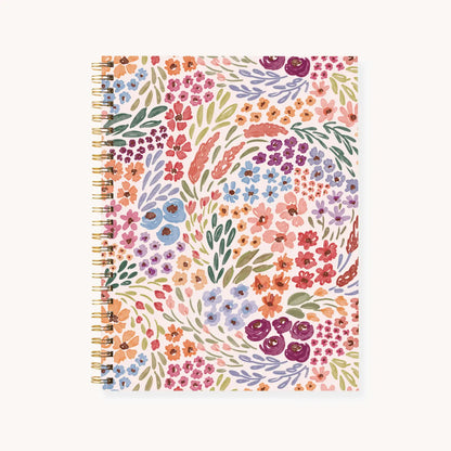 Notebook with a colorful floral pattern on a white background
