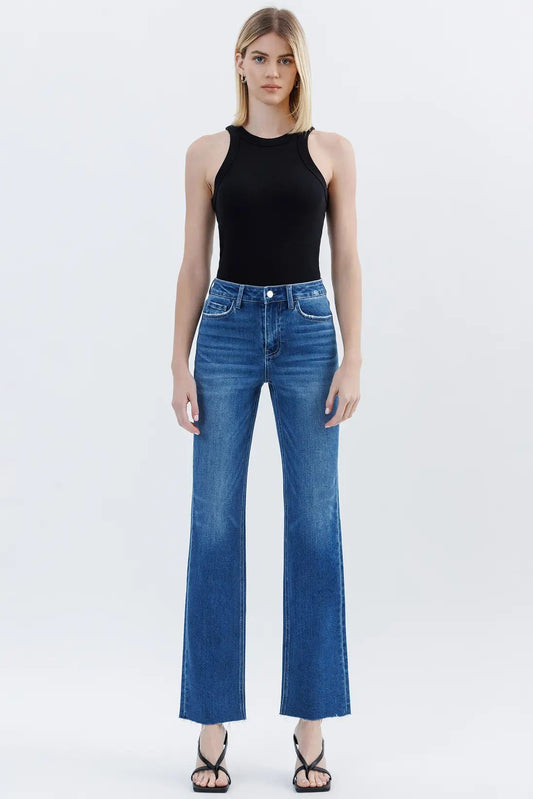 woman in black tank and medium wash denim