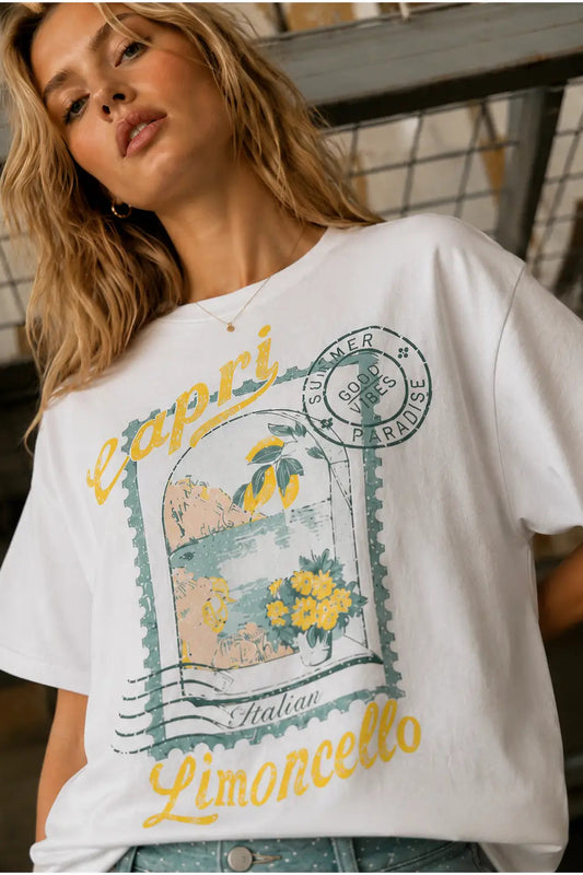 Woman wearing a white t-shirt with a graphic design and text