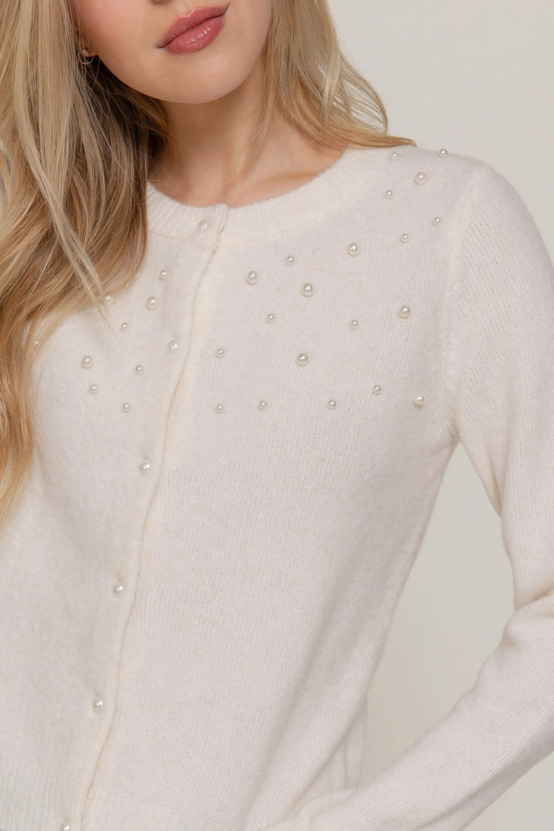 woman in pearl cardigan 
