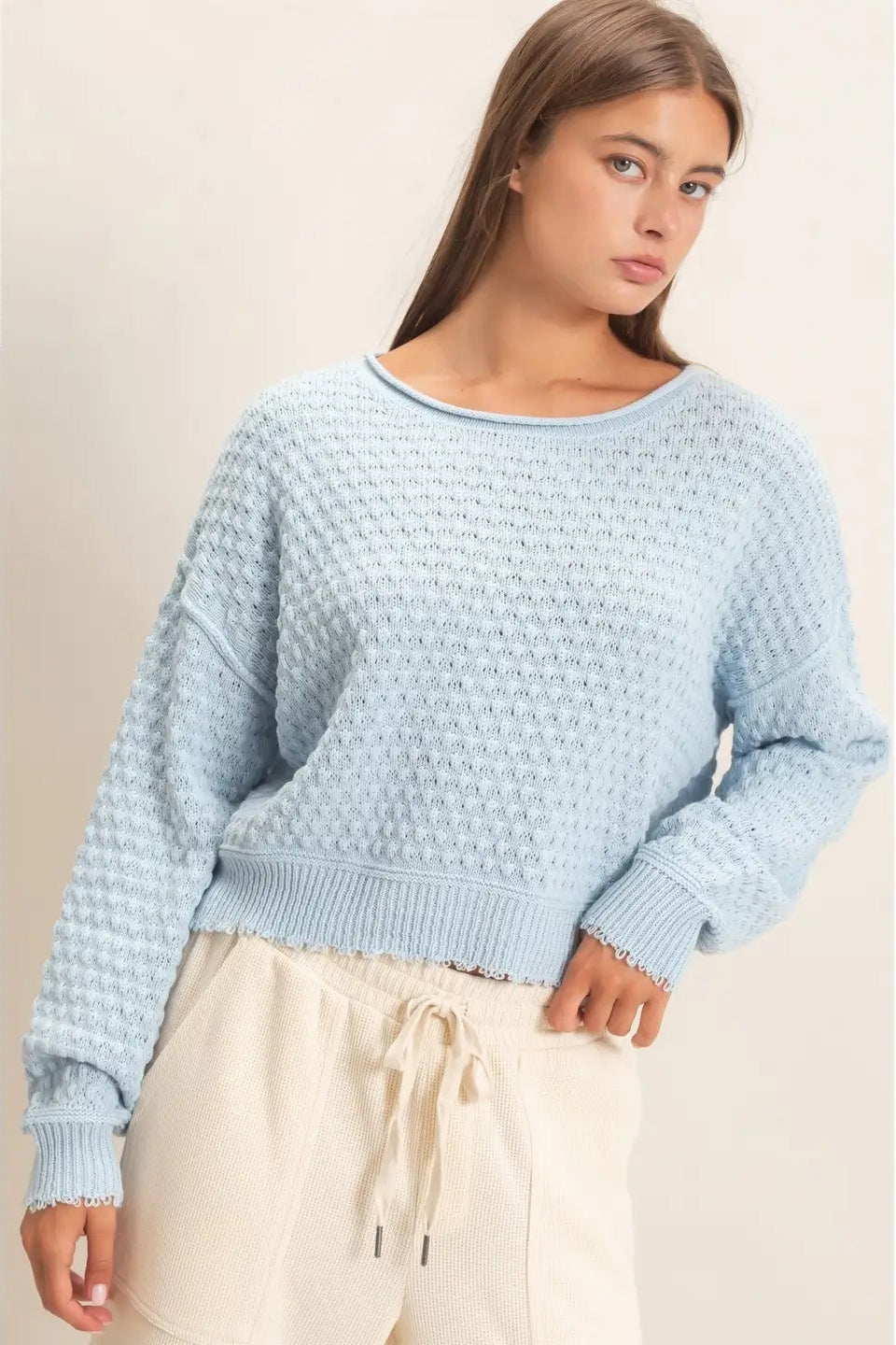 woman wearing blue sweater