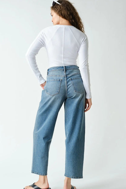 woman in henley long sleeve top and jeans