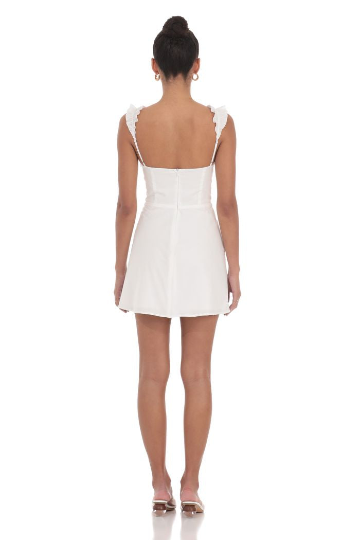 Woman wearing a white dress on a white background