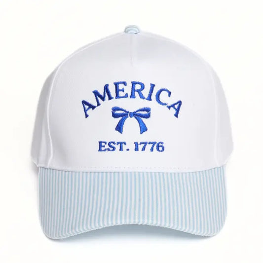 baseball hat with american est. 1776 on the front with a bow