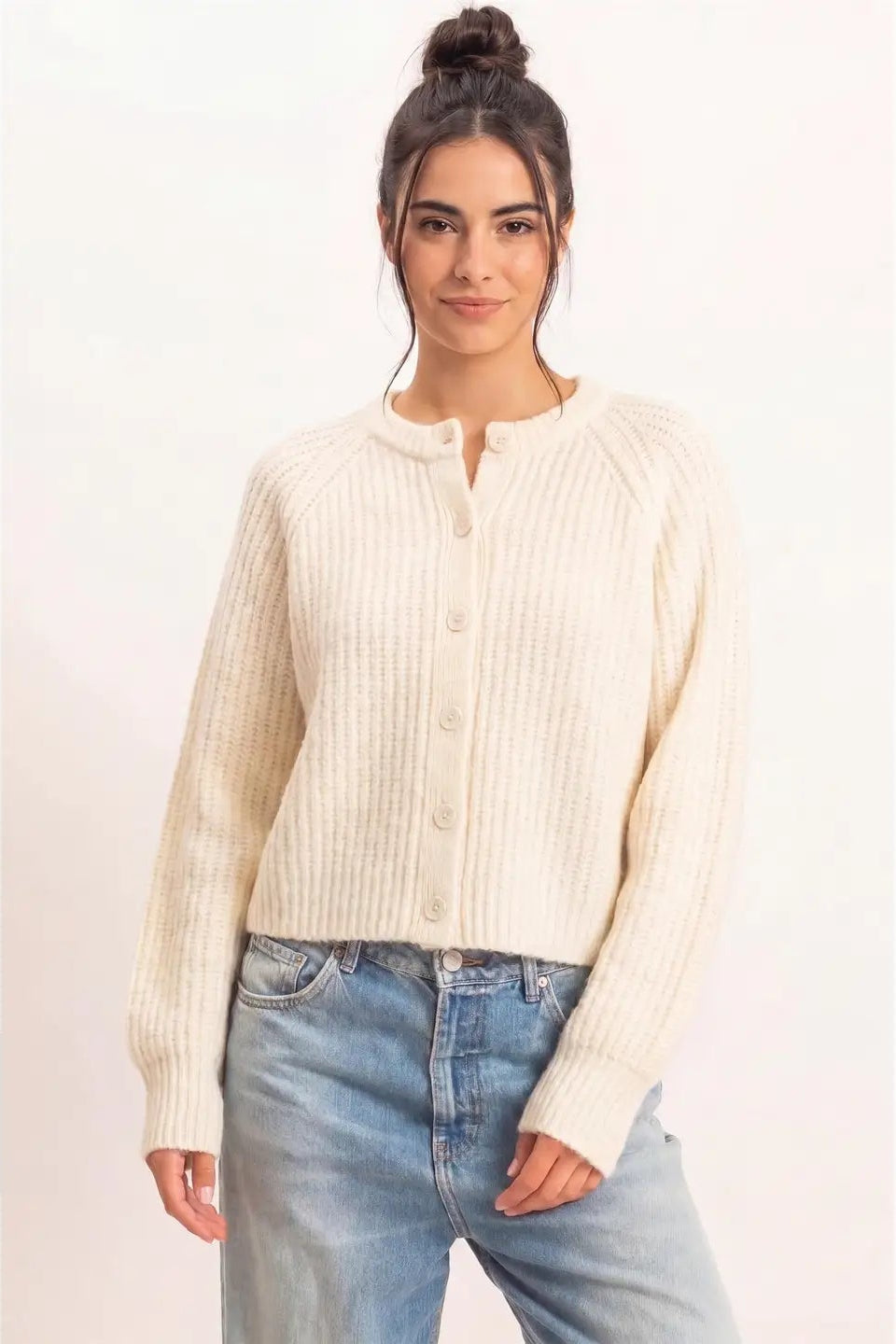 woman in cardi and jeans