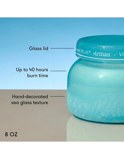 Blue candle jar with text detailing features on a blue background